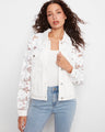 White twill jacket featuring a classic shirt collar and floral embroidered sleeves, perfect for any occasion by Charlie B.
