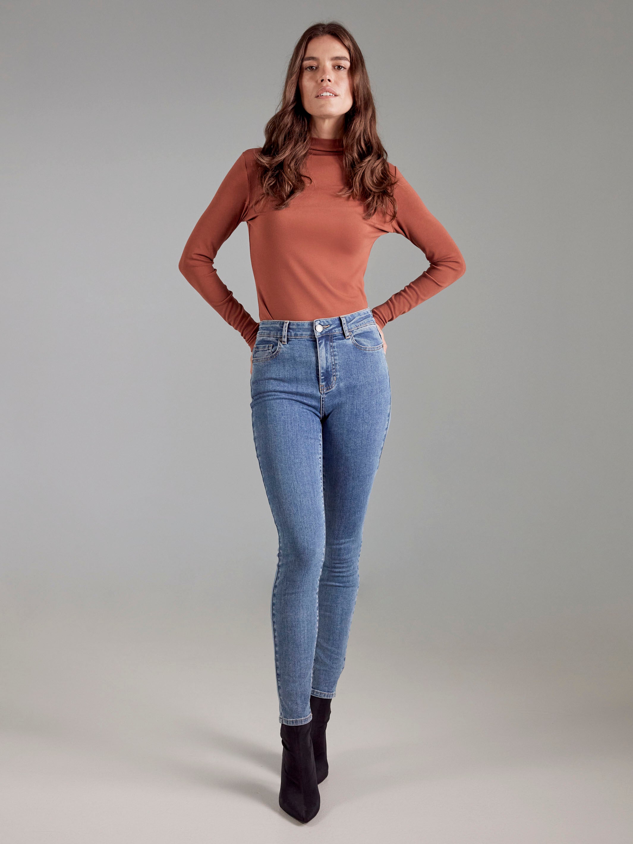 Sepia mock neck top with a flattering slim fit and fine ribbed detail, adding elegance to your everyday look by Charlie B.
