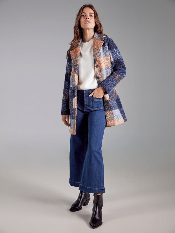Versatile moonlight plaid boucle knit coat designed with practical button front closure for easy layering by Charlie B.