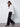 Fashion-forward white sweater with drop shoulders and subtle speckles, effortlessly stylish by Charlie B.