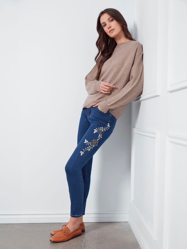 Elegant taupe sweater designed with a boat neck and front seam detail for added sophistication by Charlie B.