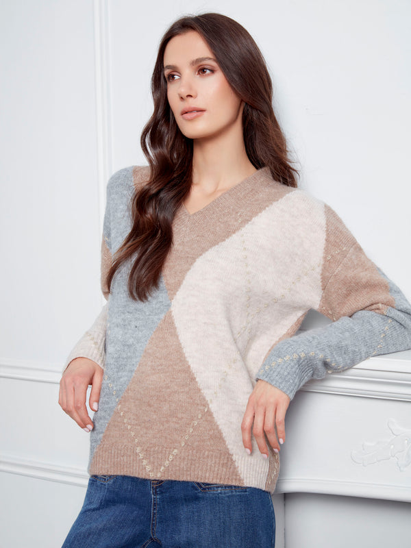 Elegant Heather Sesame V-neck sweater featuring a timeless argyle pattern for versatile styling by Charlie B.