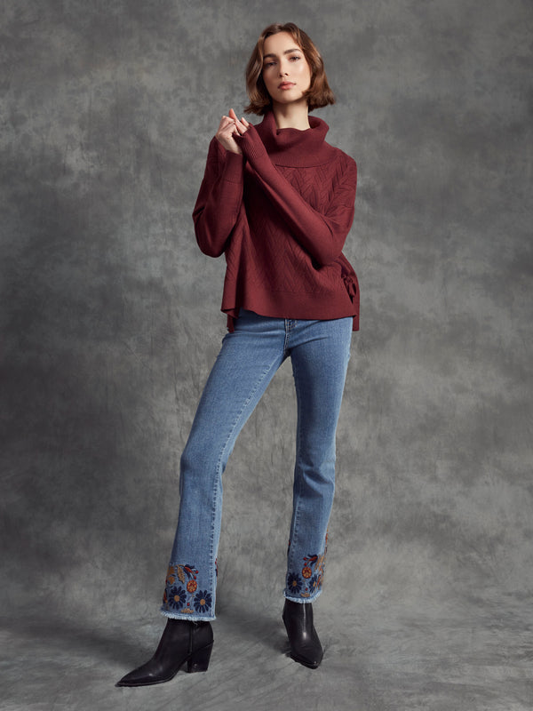 Cozy cabernet cowl neck sweater with intricate chevron pattern, offering warmth and style. By Charlie B.