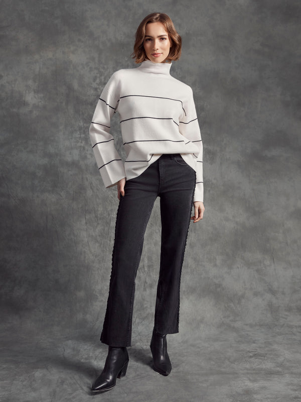 Elegant ecru sweater in a relaxed fit design, highlighted with sleek black stripe accents by Charlie B.