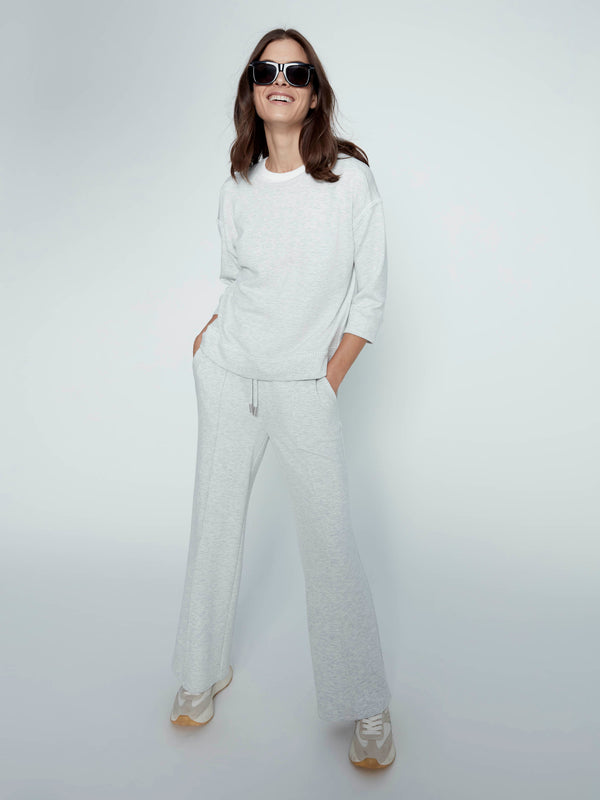 Practical slash pockets enhance the utility of these stylishly designed long length trousers. By Charlie B.