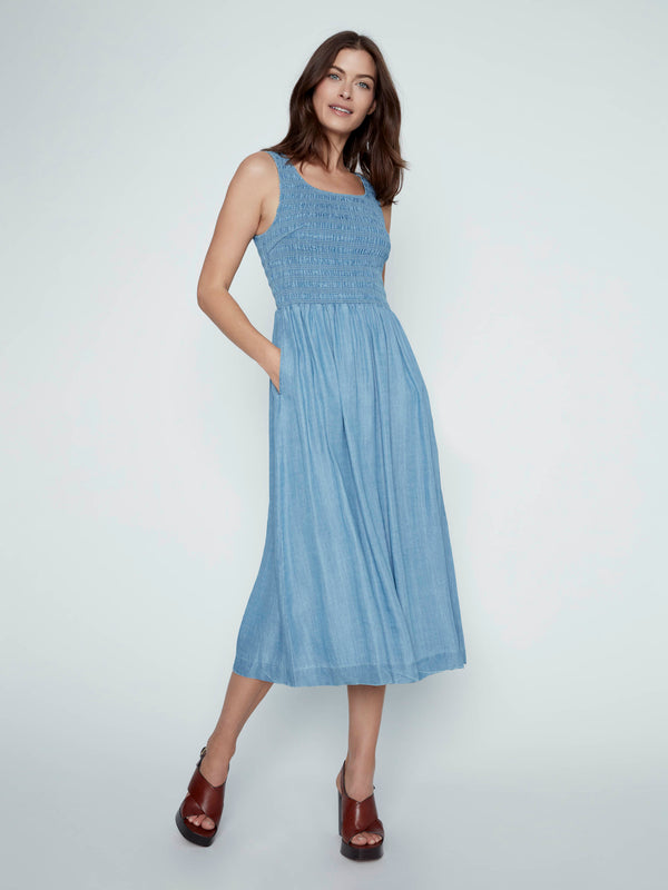 This soft blue Tencel maxi dress offers both style and practicality with its side pockets by Charlie B.