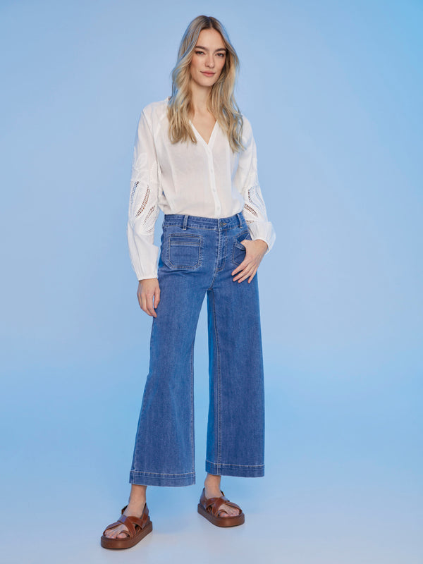 Raglan sleeve detailing enhances the overall look of this white blouse by Charlie B.