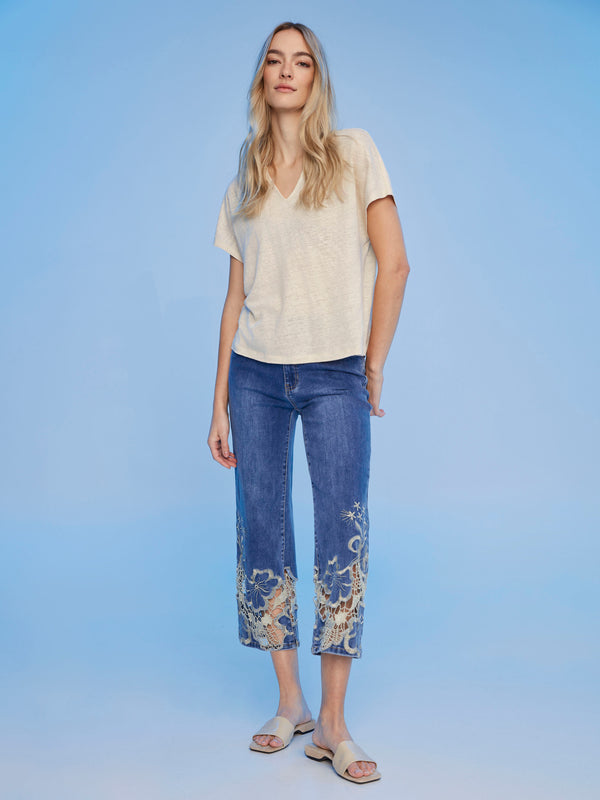 Champagne-colored dolman sleeve top with a split neck design by Charlie B.