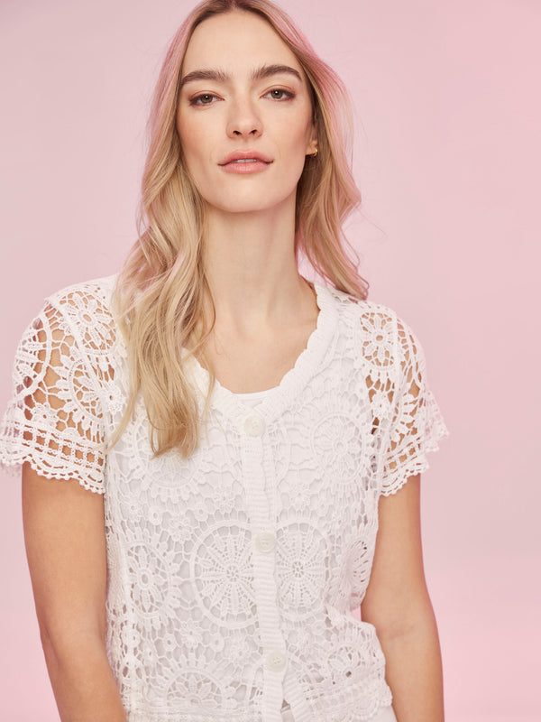 Intricate short sleeve design enhances this chic crocheted piece by Charlie B.