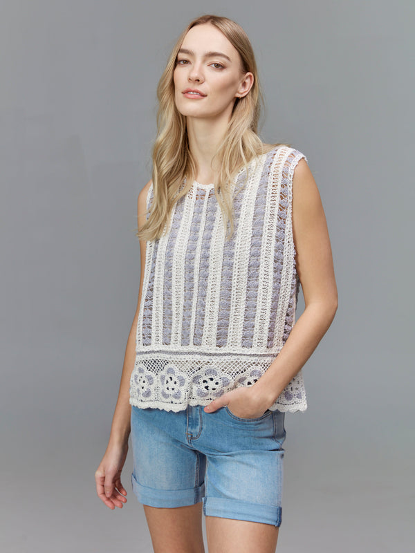 Sophisticated look achieved with a round neck and floral accents in this piece by Charlie B.
