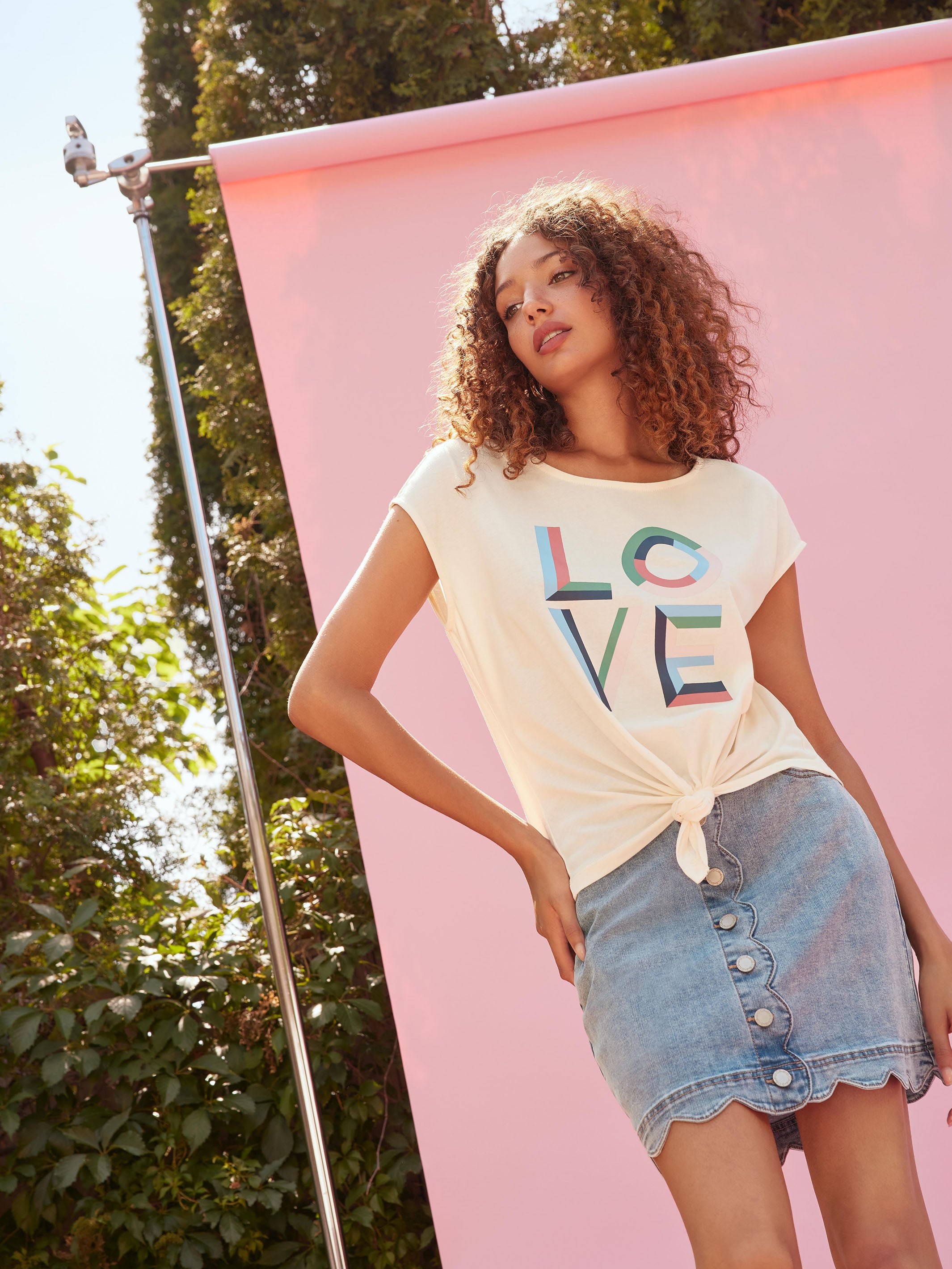 Elegant sleeveless tee boasting a vivid print and modern twist by Charlie B.
