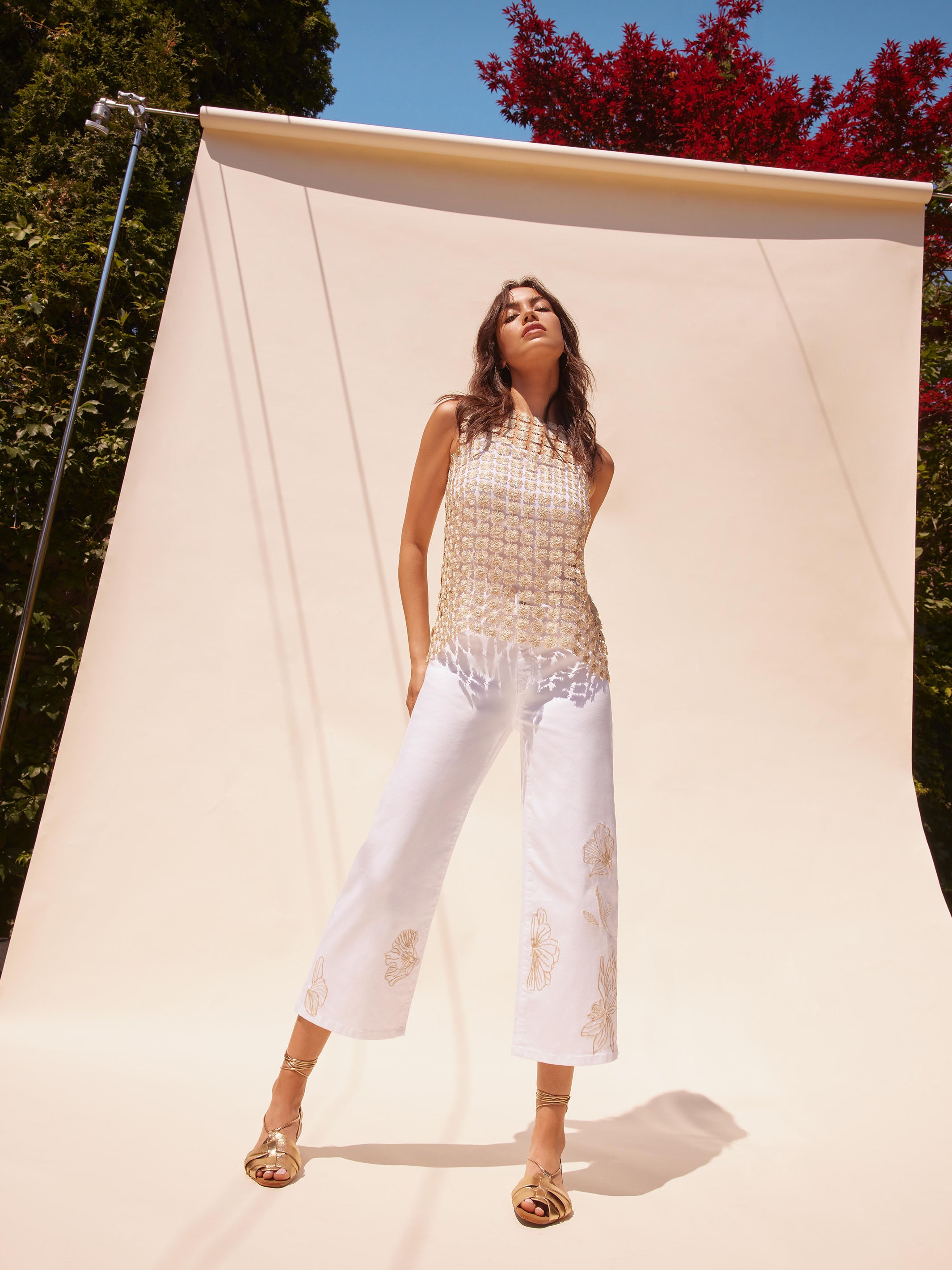 Chic cropped length with intricate floral details on white twill by Charlie B.