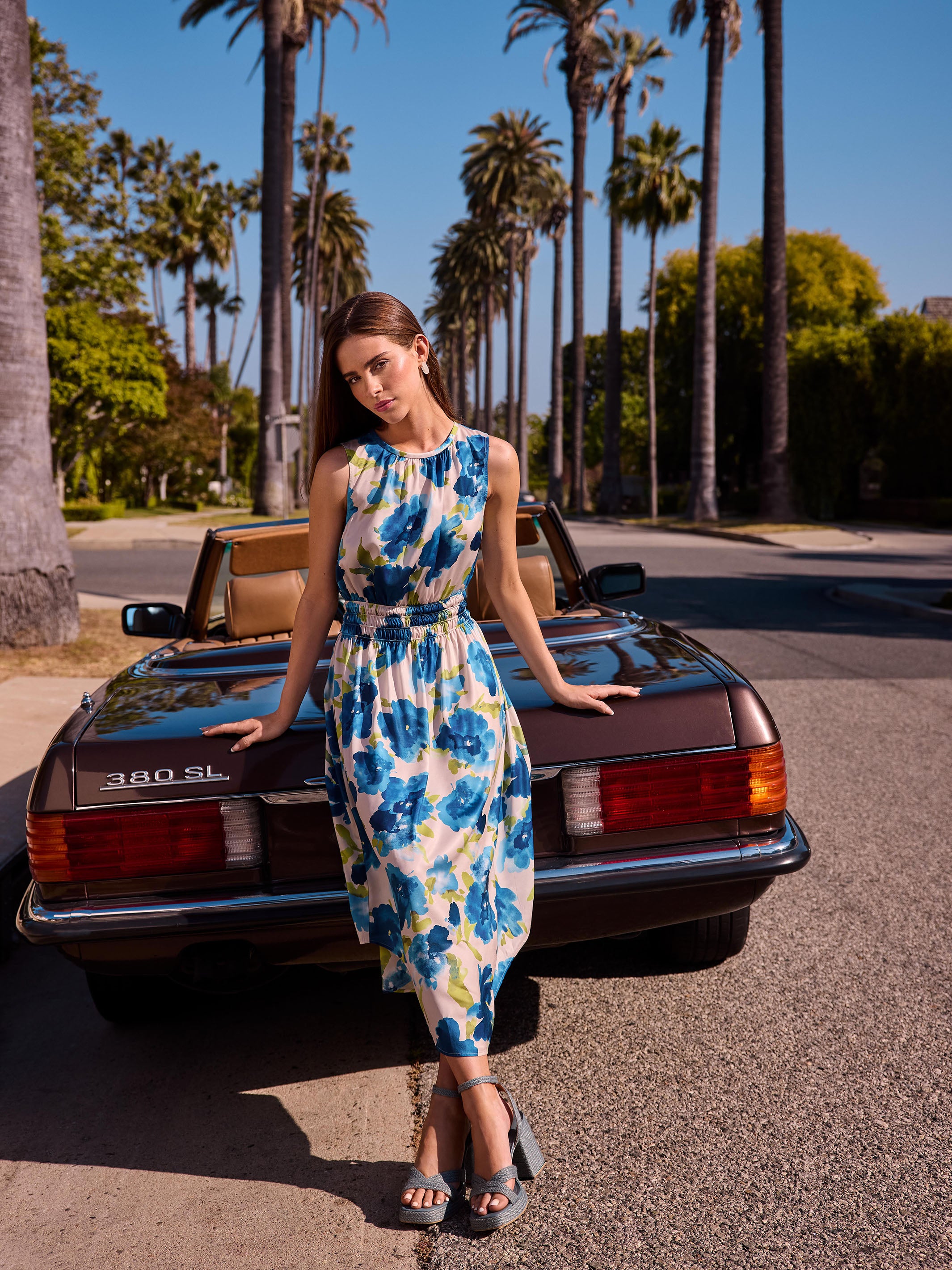 Sleeveless design in a striking blue and green pattern by Charlie B.