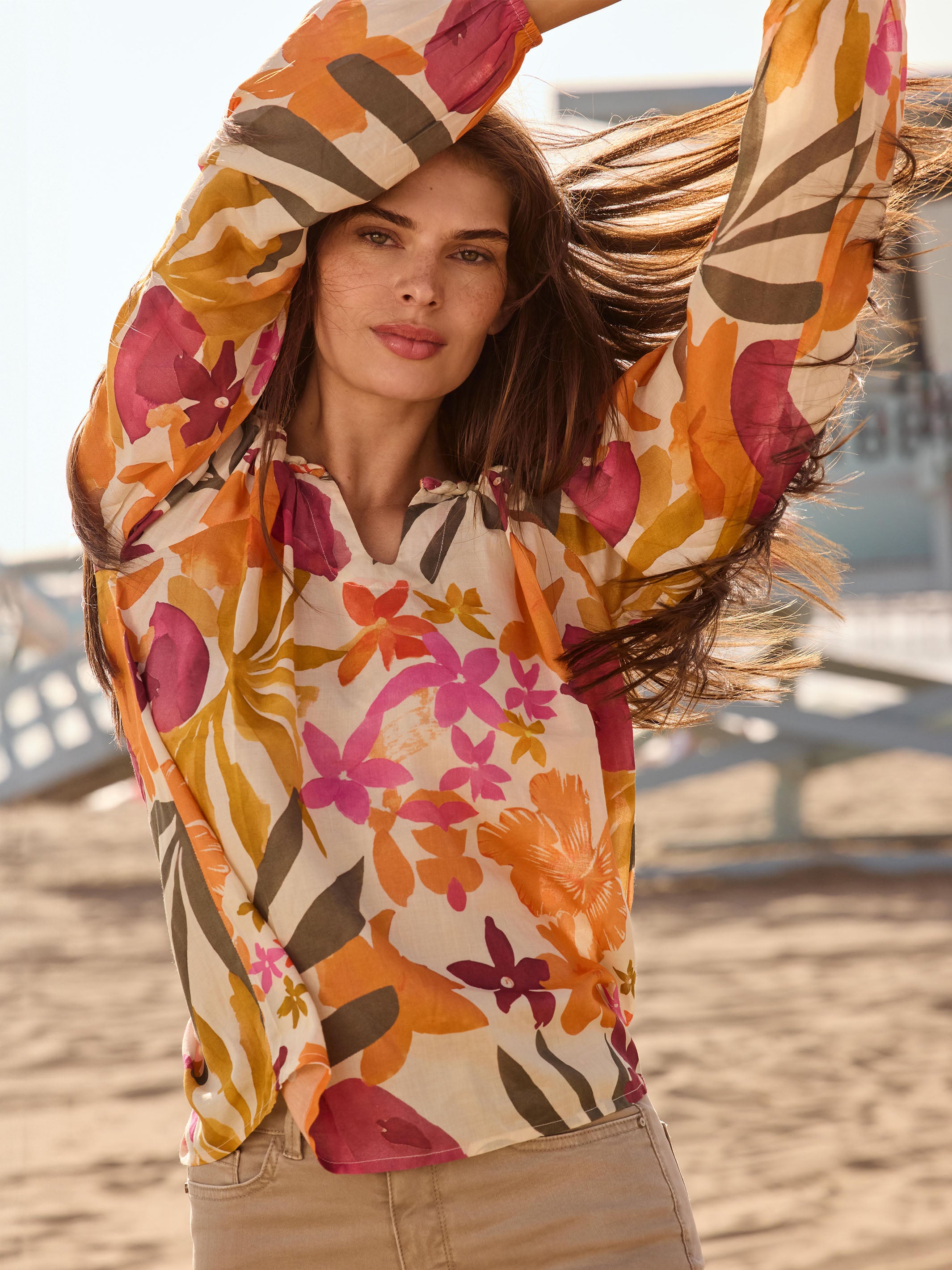 Elegant V-neck blouse adorned with colorful florals by Charlie B.
