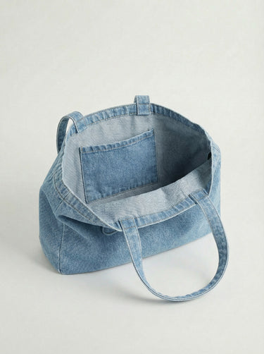 This versatile denim tote bag offers ample space with its 16” length and convenient carry handles by Charlie B.