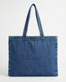 Stylish denim bag with carry handles and embossed Charlie B logo, perfect for daily use. By Charlie B.