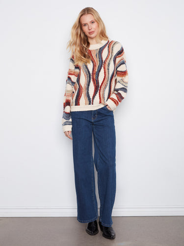 Chic sweater featuring long dolman sleeves, offering comfort and style in one piece. By Charlie B.