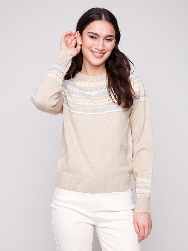 The ribbed cuffs complement the embroidered pattern on this chic heather oat jacquard sweater, ideal for any wardrobe by Charlie B.