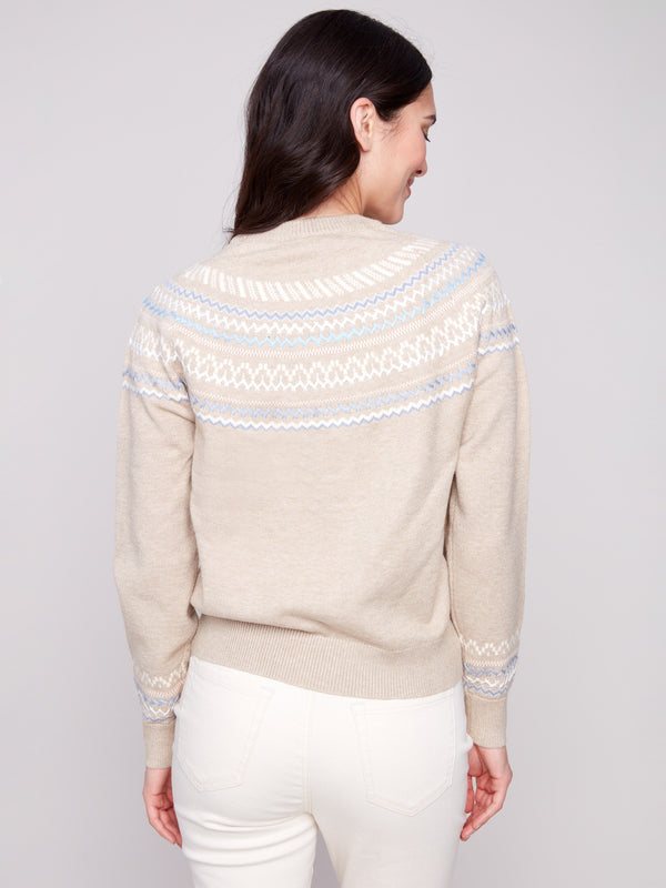 A sophisticated crew neck and raglan sleeves define this heather oat jacquard sweater with its unique patterning by Charlie B.