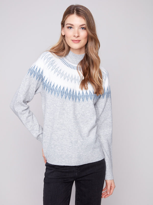 Heather light grey sweater showcasing a mock neck and geometric jacquard pattern, highlighting its relaxed fit by Charlie B.