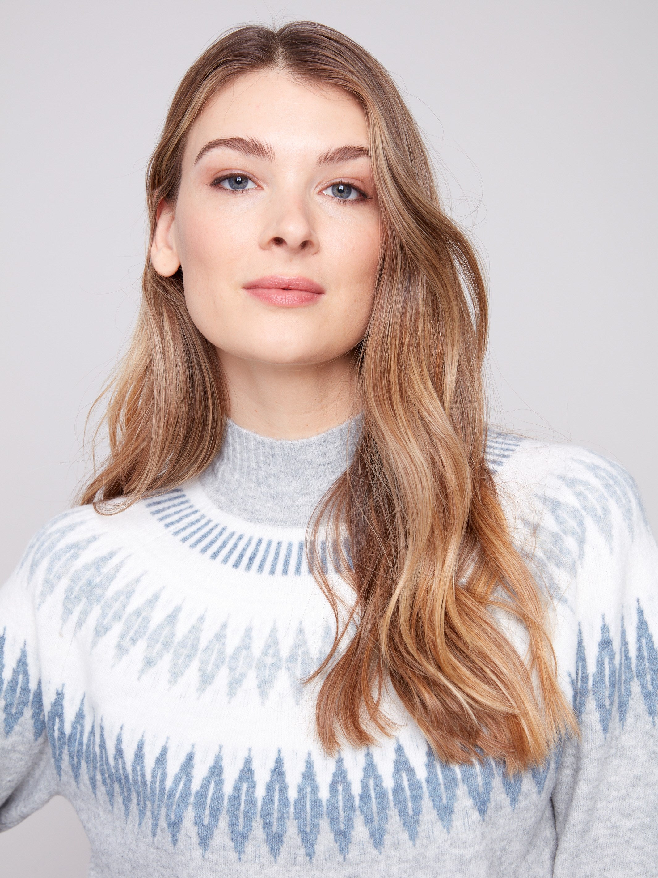 Sweater in heather light grey with a mock neck and intricate jacquard detail, offering a relaxed fit by Charlie B.