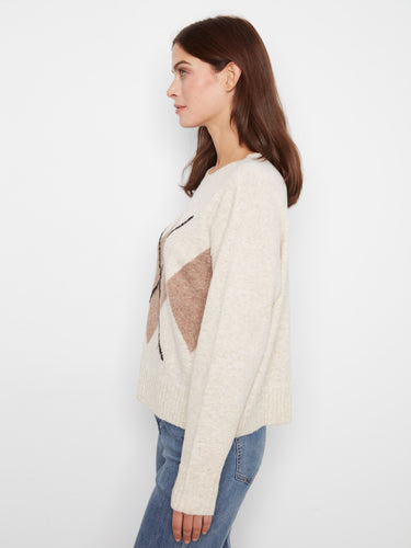 The argyle pattern brings a touch of traditional charm with modern flair to the sweater by Charlie B.