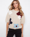 Cozy mock neck sweater with playful floral design, crafted from soft brushed knit for ultimate comfort by Charlie B.
