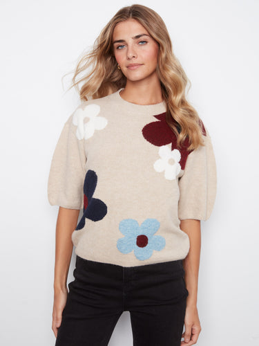 Cozy mock neck sweater with playful floral design, crafted from soft brushed knit for ultimate comfort by Charlie B.