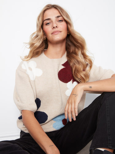 Embrace the relaxed fit of this charming sweater, featuring balloon elbow sleeves and a delightful floral pattern by Charlie B.