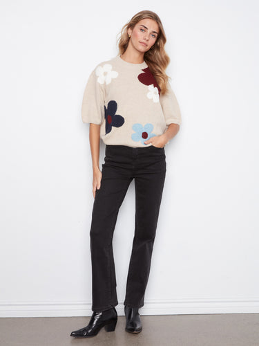 Soft brushed knit sweater adorned with vibrant flowers, offering a cozy yet stylish look perfect for any occasion by Charlie B.