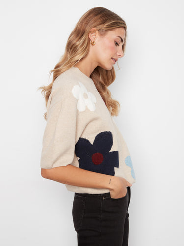 Elegant mock neck design paired with a playful floral print makes this soft knit sweater a wardrobe essential by Charlie B.