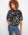 Stylish sweater featuring a mock neck, perfect for cozy days. The unique pattern adds flair to any outfit by Charlie B.