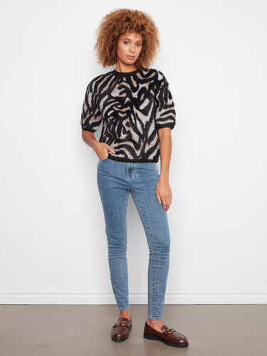 This sweater's balloon elbow sleeves offer a trendy twist on classic knitwear, making it a must-have for fashion lovers by Charlie B.