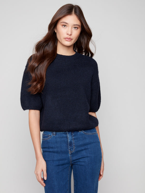 Stylish sweater showcasing plush knit design with unique elbow sleeves by Charlie B.