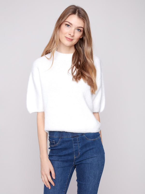 Ecru knit sweater featuring plush texture and balloon-shaped elbow sleeves, adding a touch of elegance to any outfit by Charlie B.