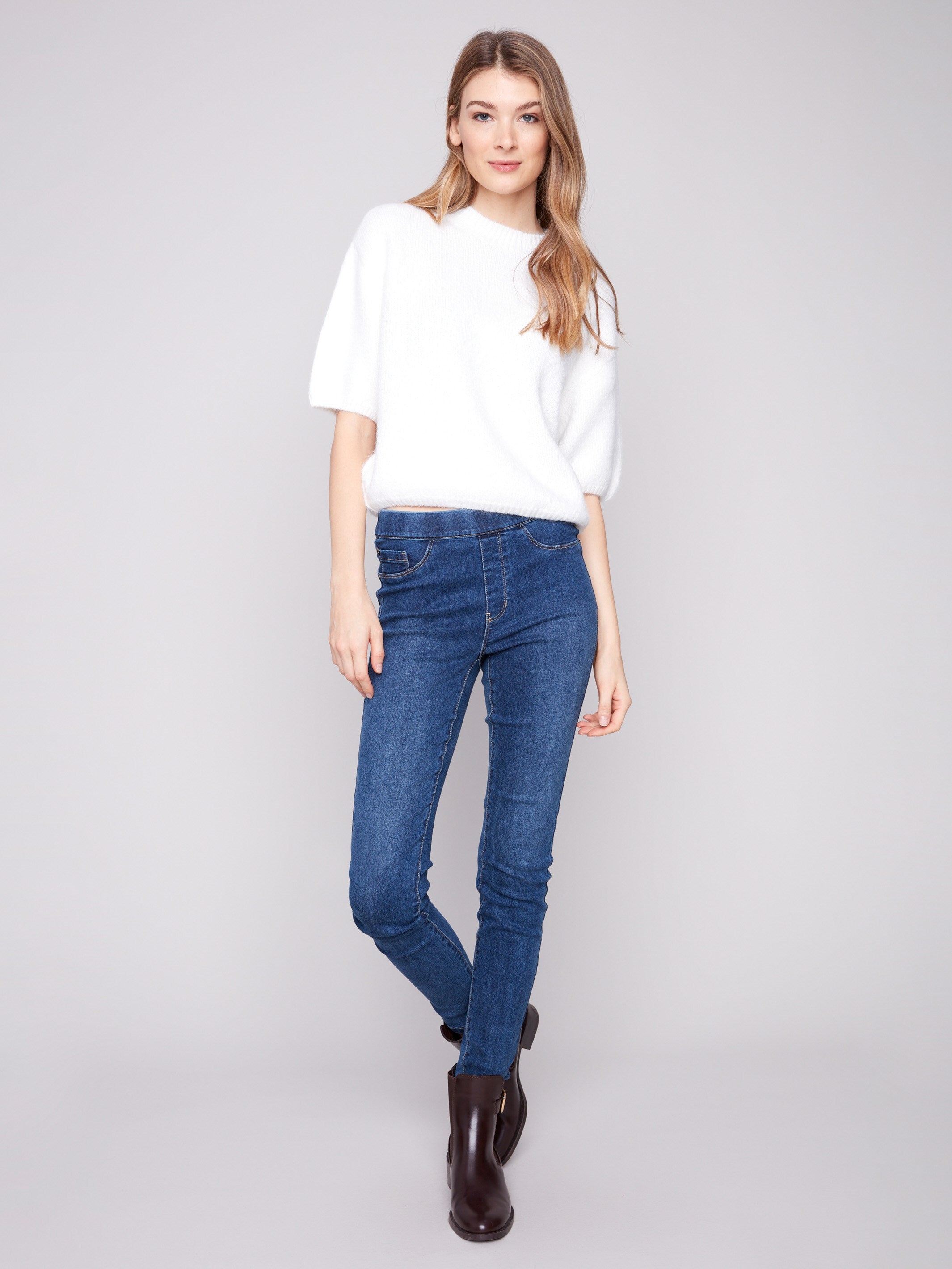 Soft ecru sweater with a relaxed fit, perfect for cozy days while maintaining style and comfort by Charlie B.