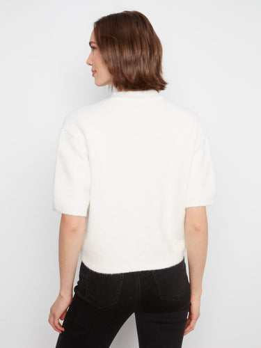 Balloon elbow sleeves create a unique silhouette, enhancing the overall appeal by Charlie B.