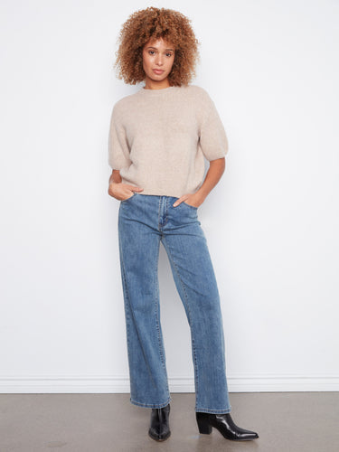 Crafted from soft brushed knit, this piece ensures comfort and warmth throughout the day. By Charlie B.