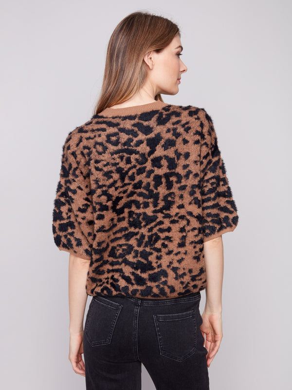 Embrace the crew neckline of this leopard print sweater for a timeless fashion statement by Charlie B.