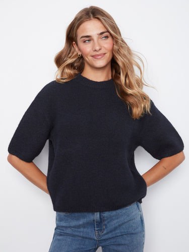 With balloon elbow sleeves, this sweater combines style and functionality effortlessly. A must-have addition by Charlie B.