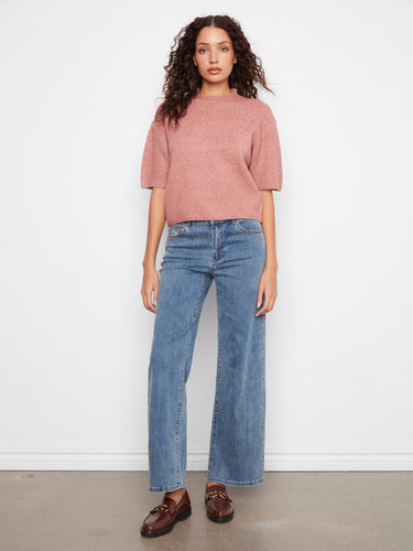 A chic addition to any closet, this knit top combines fashion-forward design with timeless appeal by Charlie B.