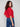 Chic crimson sweater showcasing plush knit fabric and fashionable balloon sleeves for trendsetting style by Charlie B.