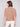 Soft sesame knit sweater showcasing balloon-shaped elbow sleeves for a chic look by Charlie B.