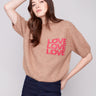 Knit sweater in truffle with a relaxed fit and 'LOVE' graphic, perfect for casual comfort by Charlie B.