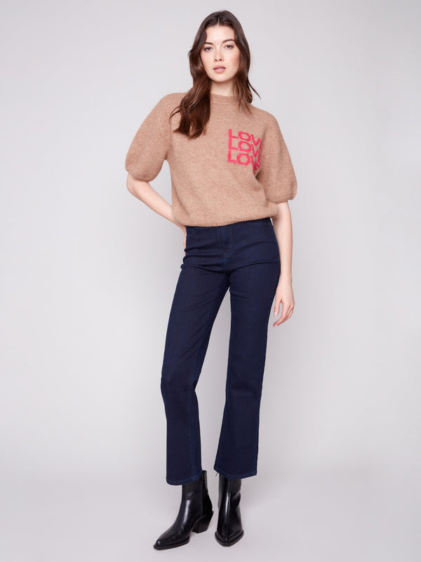 Truffle knit sweater featuring a crew neckline and bold 'LOVE' print for a stylish look by Charlie B.