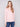 Soft pink sweater with a V neckline and plush texture, offering a cozy feel perfect for cool days by Charlie B.
