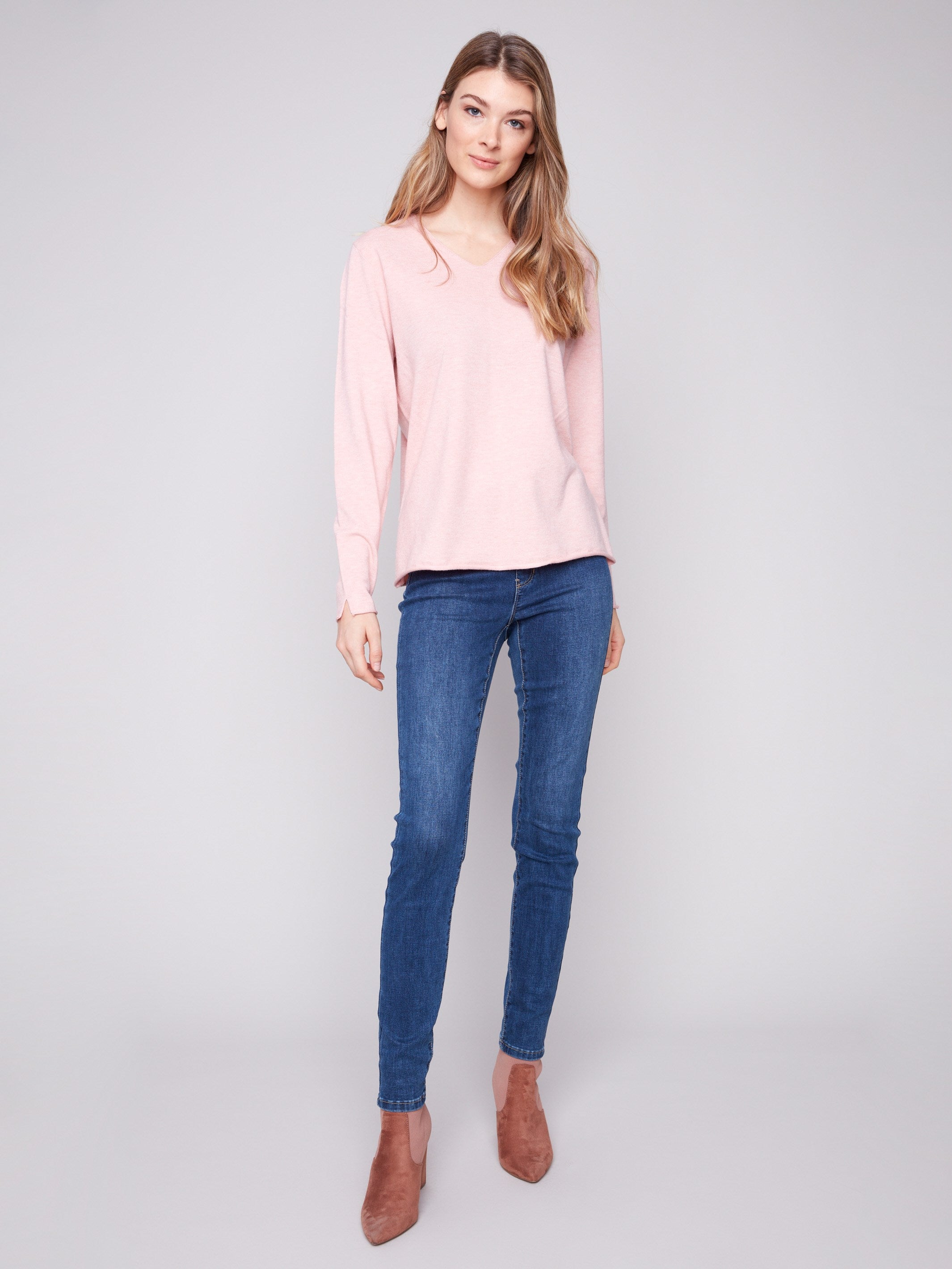 Stylish sweater featuring long sleeves and side slits, providing both comfort and versatility by Charlie B.