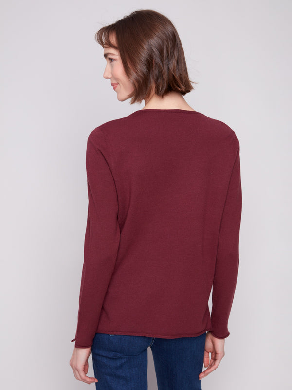Enjoy the luxurious plush texture of this Cabernet V-neck sweater for ultimate comfort by Charlie B.