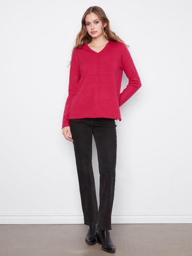 Long sleeves provide a cozy feel in this stylish knit garment. By Charlie B.