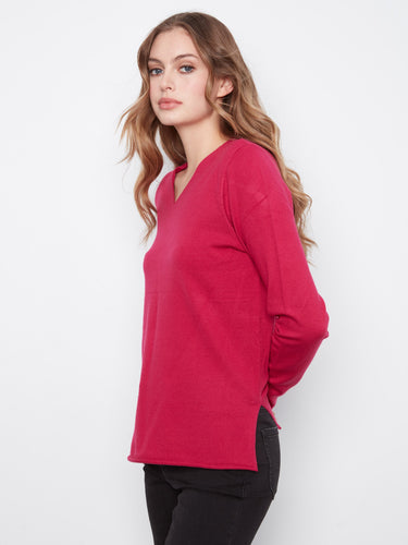 Featuring side slits, this top adds a touch of flair to your wardrobe. By Charlie B.